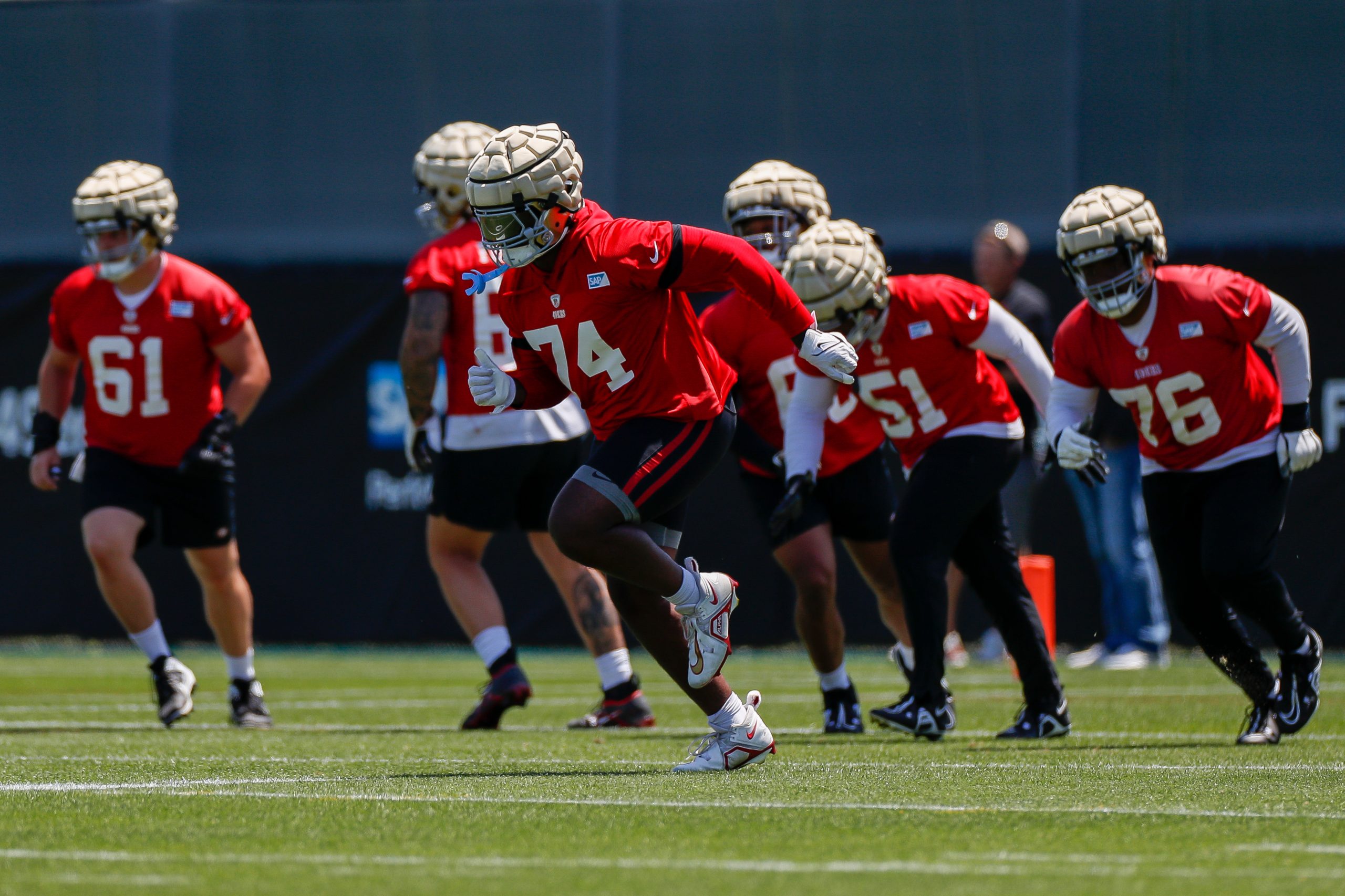 San Francisco 49ers offensive tackle Spencer Burford (74) takes part in a drill during the team's O...