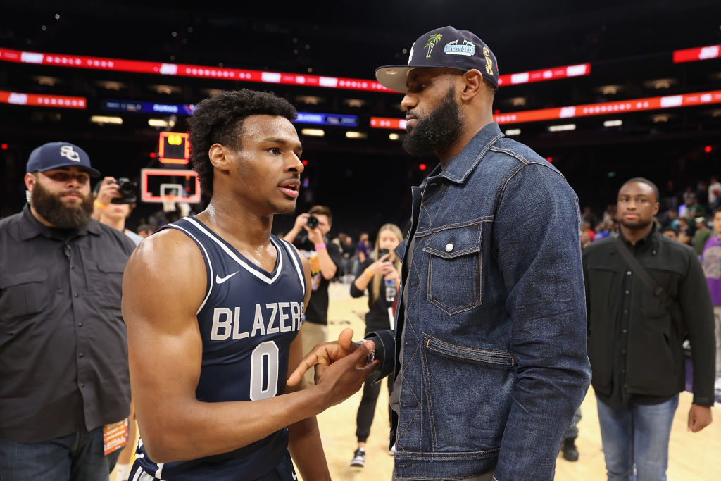 Bronny James #0 of the Sierra Canyon Trailblazers is greeted by his father and NBA player LeBron Ja...
