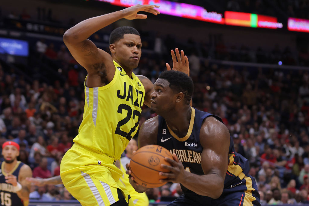 Zion Williamson #1 of the New Orleans Pelicans drives against Rudy Gay #22 of the Utah Jazz during ...