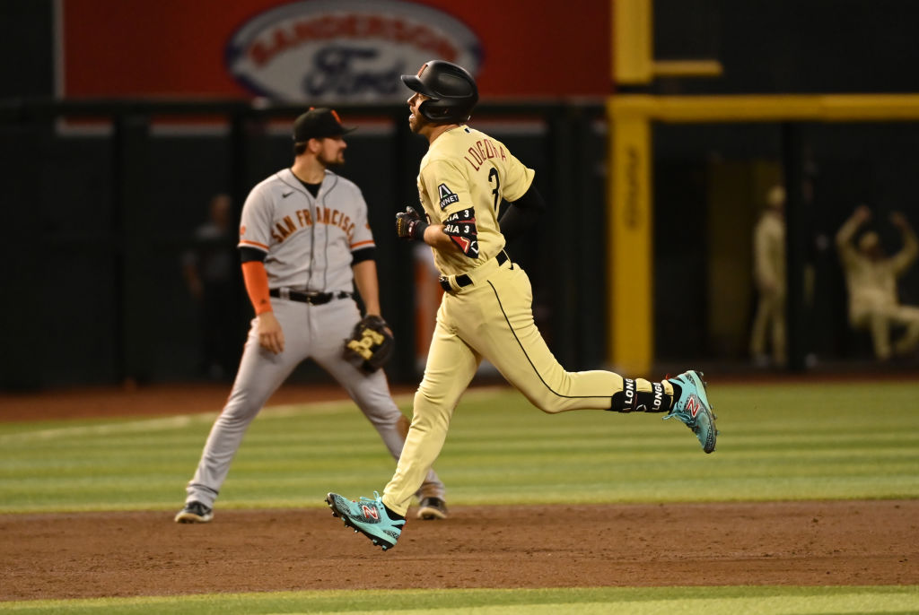 Evan Longoria #3 of the Arizona Diamondbacks rounds the bases after hitting a solo home run against...
