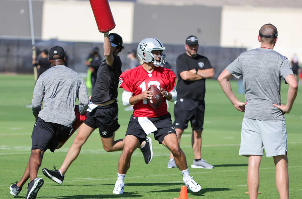 Quarterback Jimmy Garoppolo #10 of the Las Vegas Raiders throws during the first practice of the te...