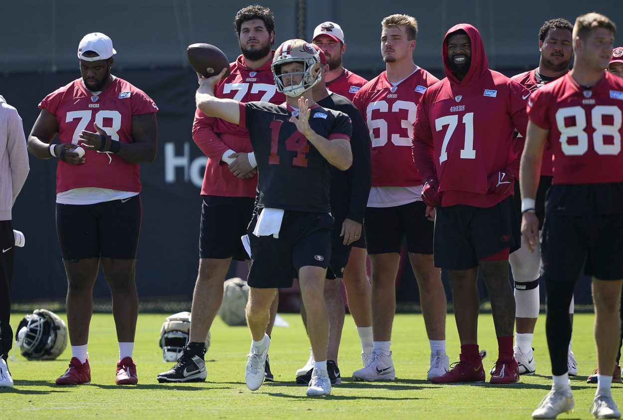 Sam Darnold #14 of the San Francisco 49ers works out during training camp at SAP Performance Facili...