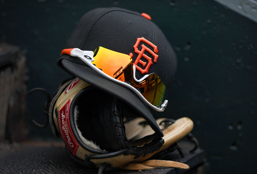 SAN FRANCISCO, CA - APRIL 21: A detailed view of the Hat, Oakley sunglasses and Rawlings baseball g...
