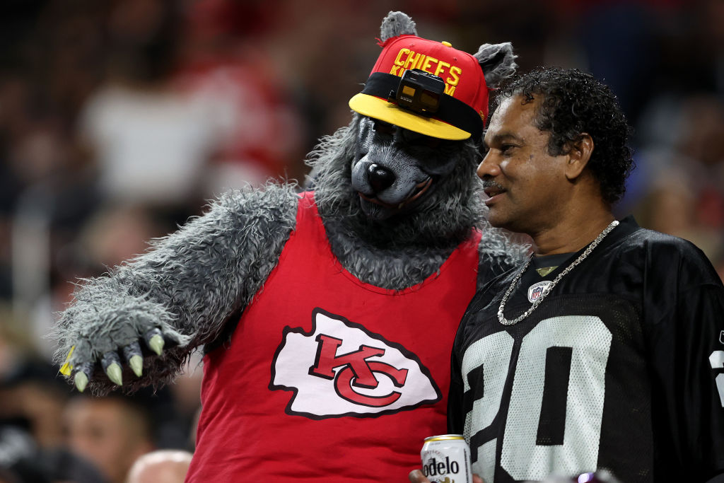 A Kansas City Chiefs fan and Las Vegas Raiders fan talk during the second half of a game at Allegia...