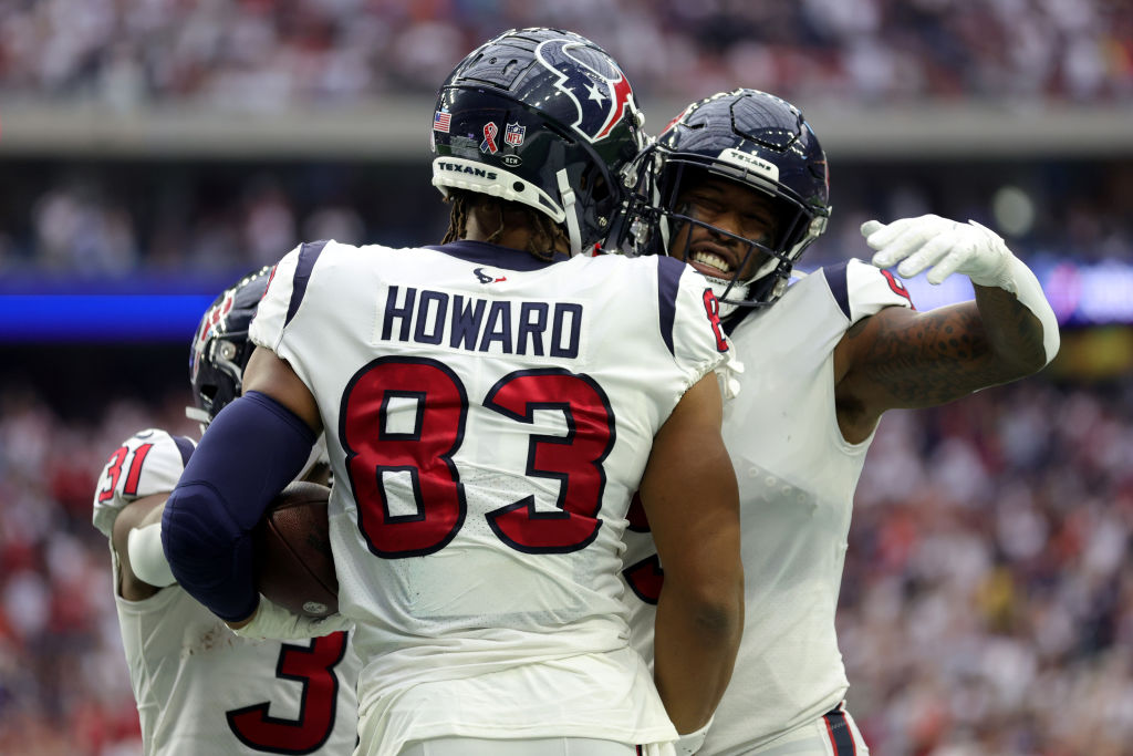O.J. Howard #83 of the Houston Texans celebrates scoring a touchdown with Brevin Jordan #9 during t...