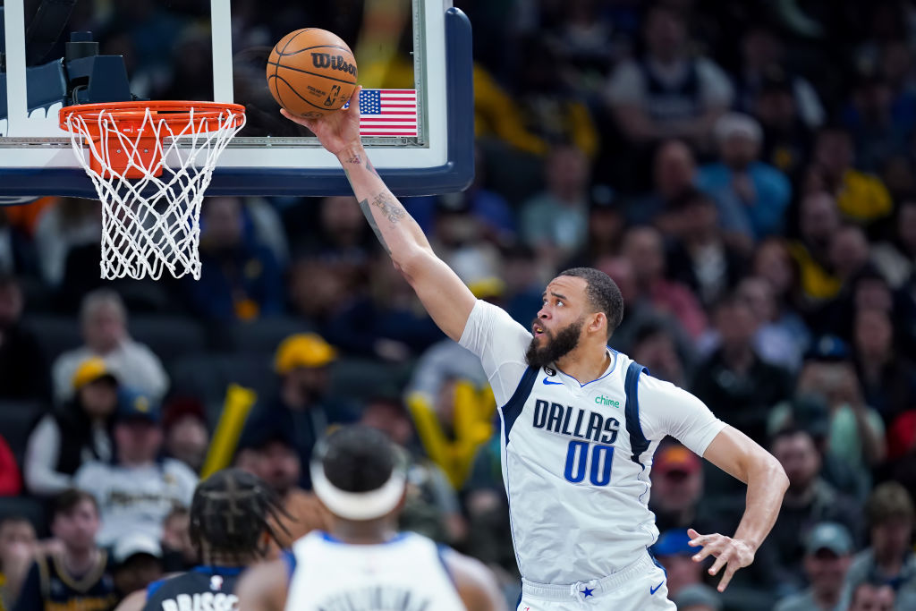INDIANAPOLIS, INDIANA - MARCH 27: JaVale McGee #00 of the Dallas Mavericks attempts a layup in the ...