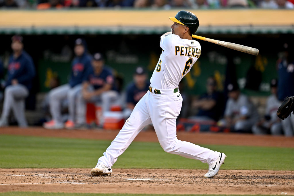 Jace Peterson #6 of the Oakland Athletics hits a single to score Seth Brown #15 of the Oakland Athl...
