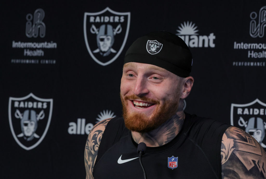 Defensive end Maxx Crosby #98 of the Las Vegas Raiders laughs during a news conference after the fi...