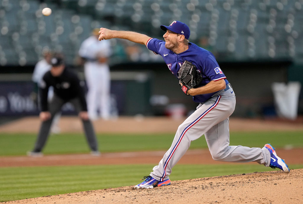 Max Scherzer #31 of the Texas Rangers pitches against the Oakland Athletics in the bottom of the fo...