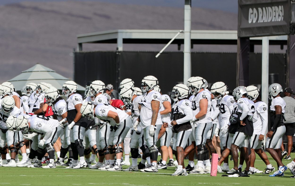The Las Vegas Raiders stretch during a joint practice with the San Francisco 49ers at the Las Vegas...
