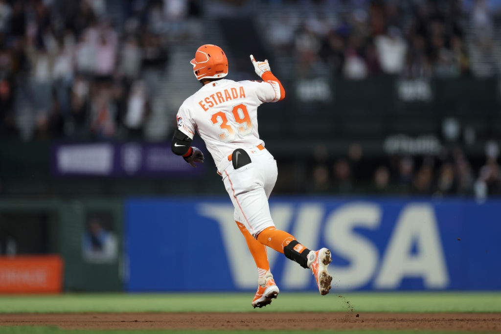 Thairo Estrada #39 of the San Francisco Giants reacts as he rounds the bases after he hit a home ru...