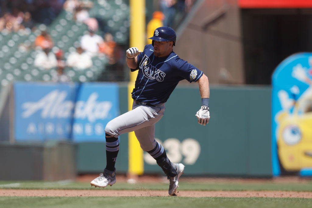 Luke Raley #55 of the Tampa Bay Rays rounds the bases to score after hitting an inside-the-park hom...