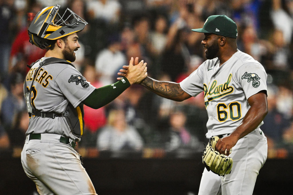 Catcher Shea Langeliers #23 and pitcher Francisco Perez #60 of the Oakland Athletics celebrate afte...