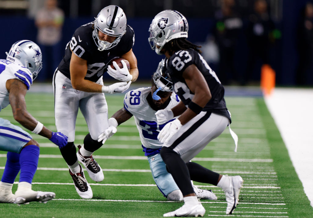 Jesper Horsted #80 of the Las Vegas Raiders carries the ball against the Dallas Cowboys during the ...