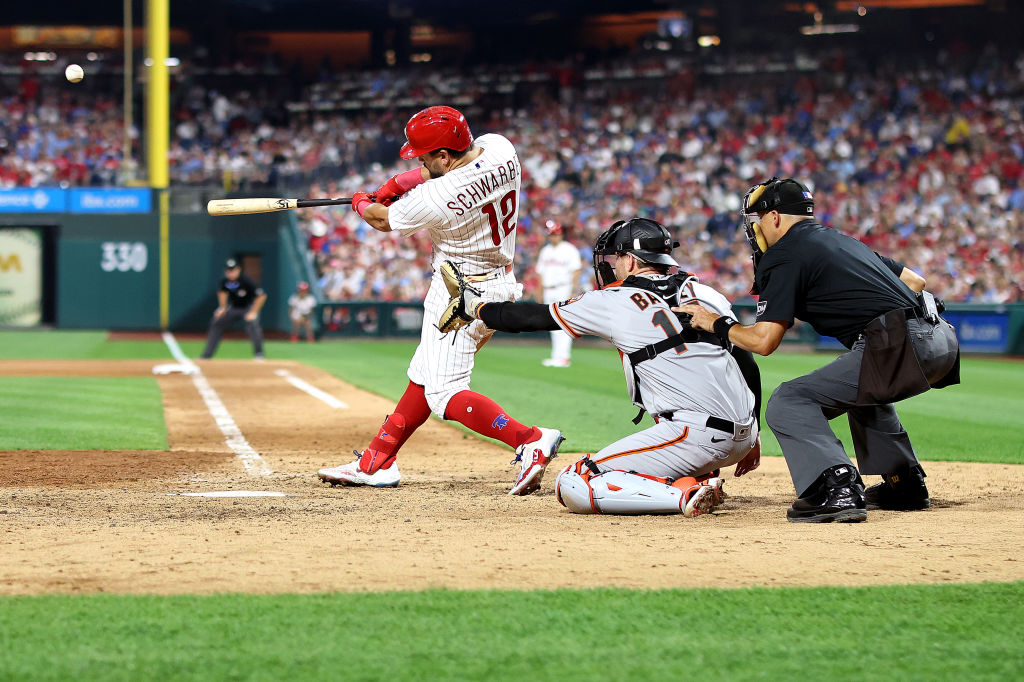 Kyle Schwarber #12 of the Philadelphia Phillies hits a two run home run during the seventh inning a...
