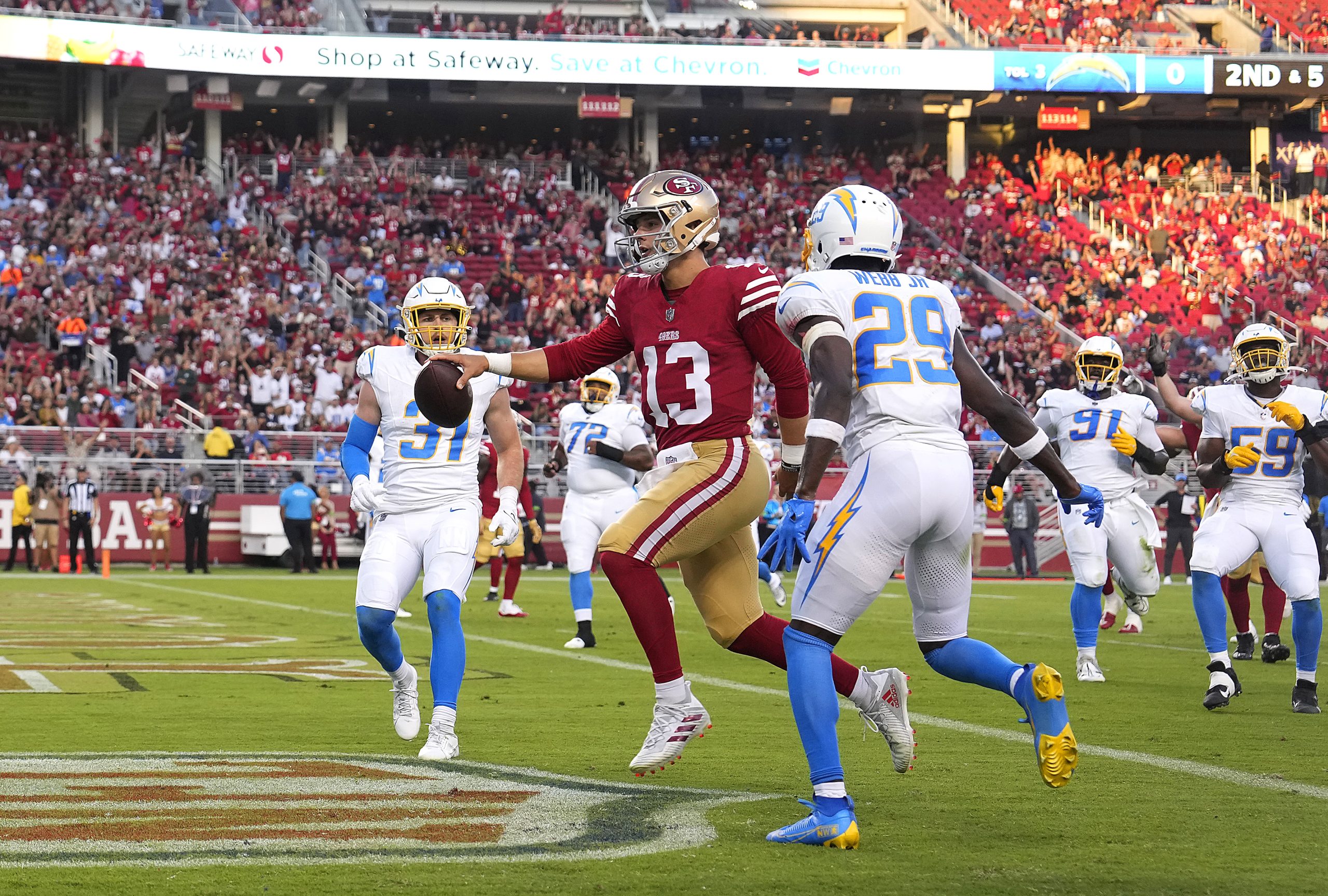 Brock Purdy #13 of the San Francisco 49ers scores a touchdown on a five yard runagainst the Los Ang...