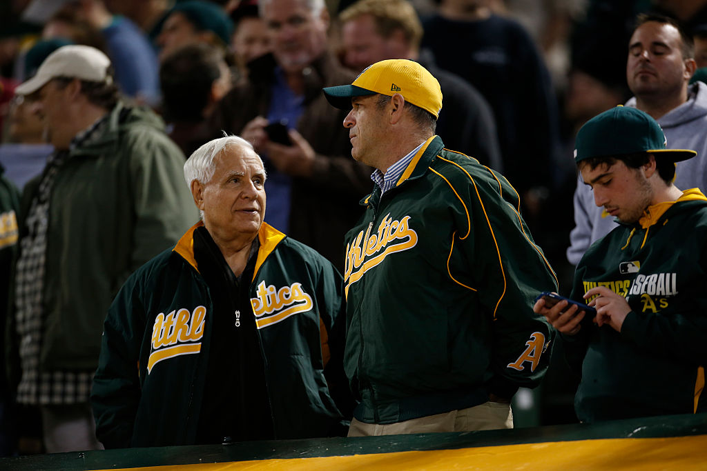 Owner Lew Wolff (left) and Owner John Fisher (right) of the Oakland Athletics talk in the stands du...