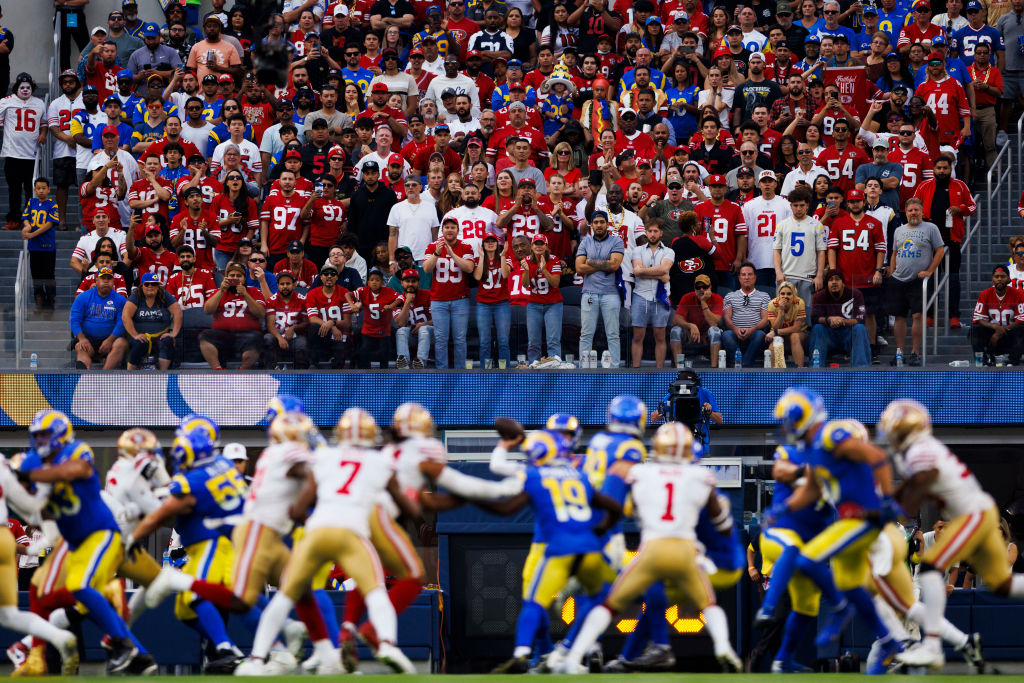 San Francisco 49ers fans cheer while the Los Angeles Rams is on the field during an NFL football ga...
