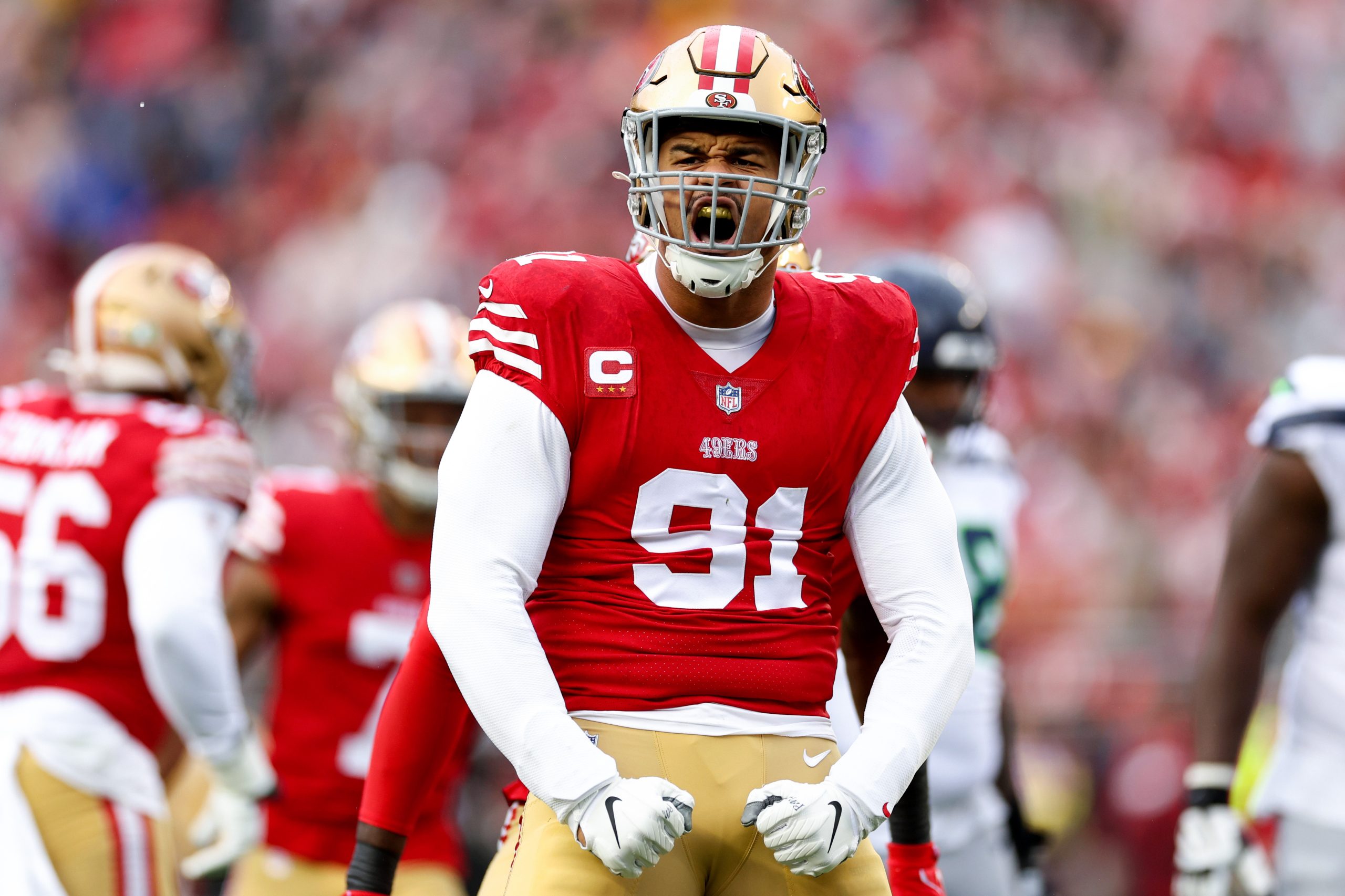 Arik Armstead #91 of the San Francisco 49ers celebrates after sacking Geno Smith #7 of the Seattle ...