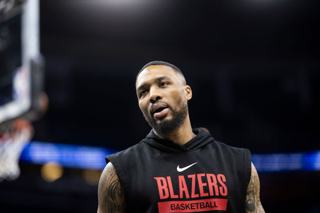 Damian Lillard #0 of the Portland Trail Blazers looks on before the start of a game against the Orl...