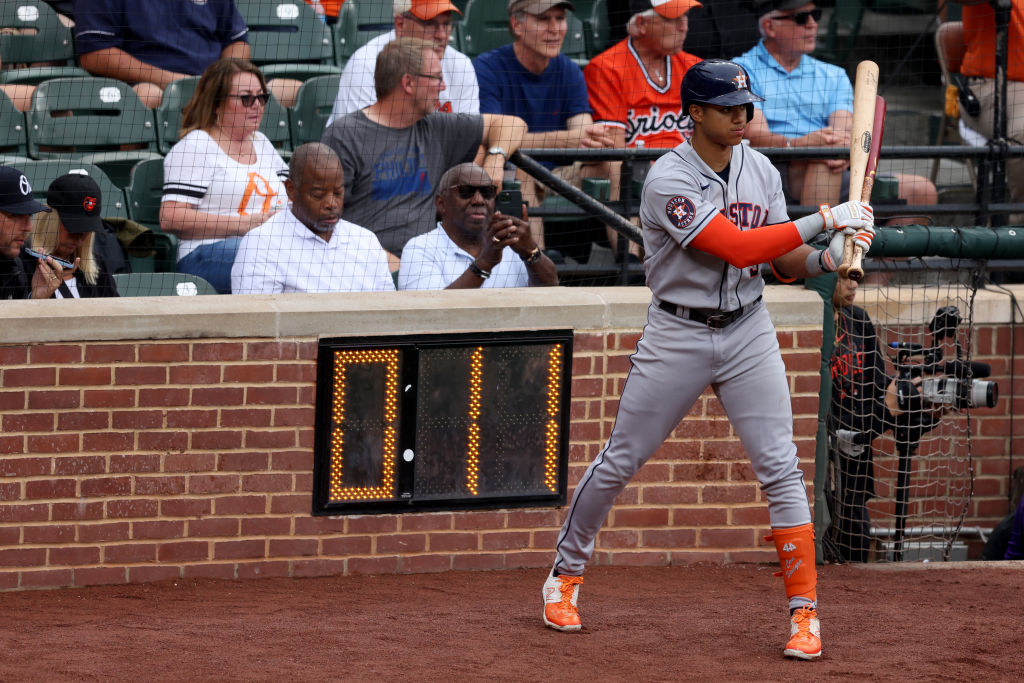 Jeremy Pena #3 of the Houston Astros waits to bat next to the pitch clock against the Baltimore Ori...