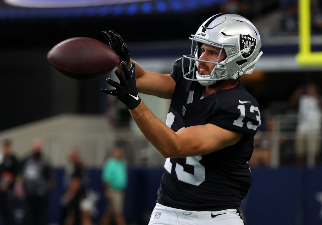 Hunter Renfrow #13 of the Las Vegas Raiders catches a pass in warm-ups before a preseason game agai...