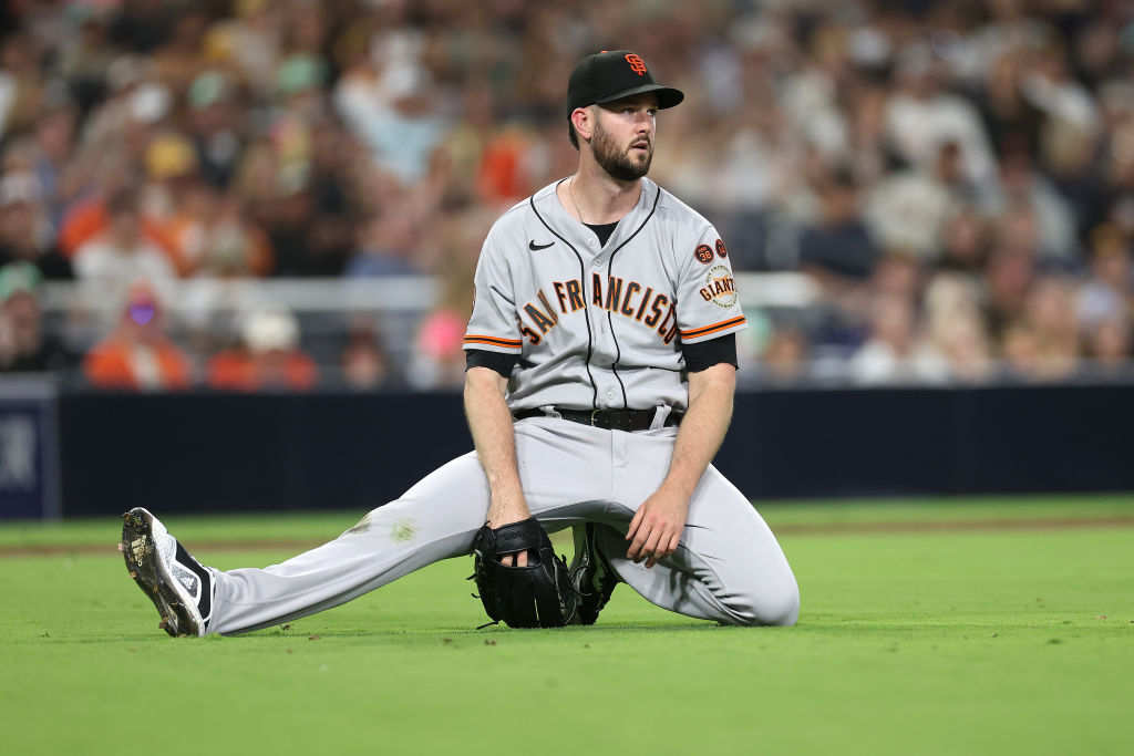 Alex Wood #57 of the San Francisco Giants looks on after throwing out Manny Machado #13 of the San ...