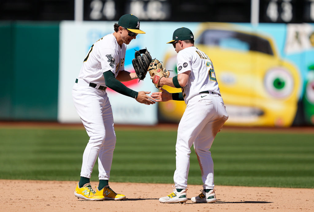 Zack Gelof (L) #20 and Nick Allen #2 of the Oakland Athletics celebrate defeating the Toronto Blue ...