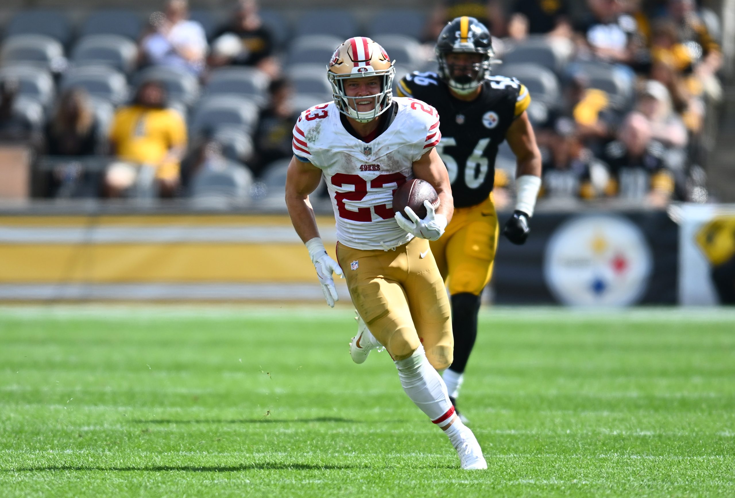 Christian McCaffrey #23 of the San Francisco 49ers runs for a touchdown in the third quarter of a g...