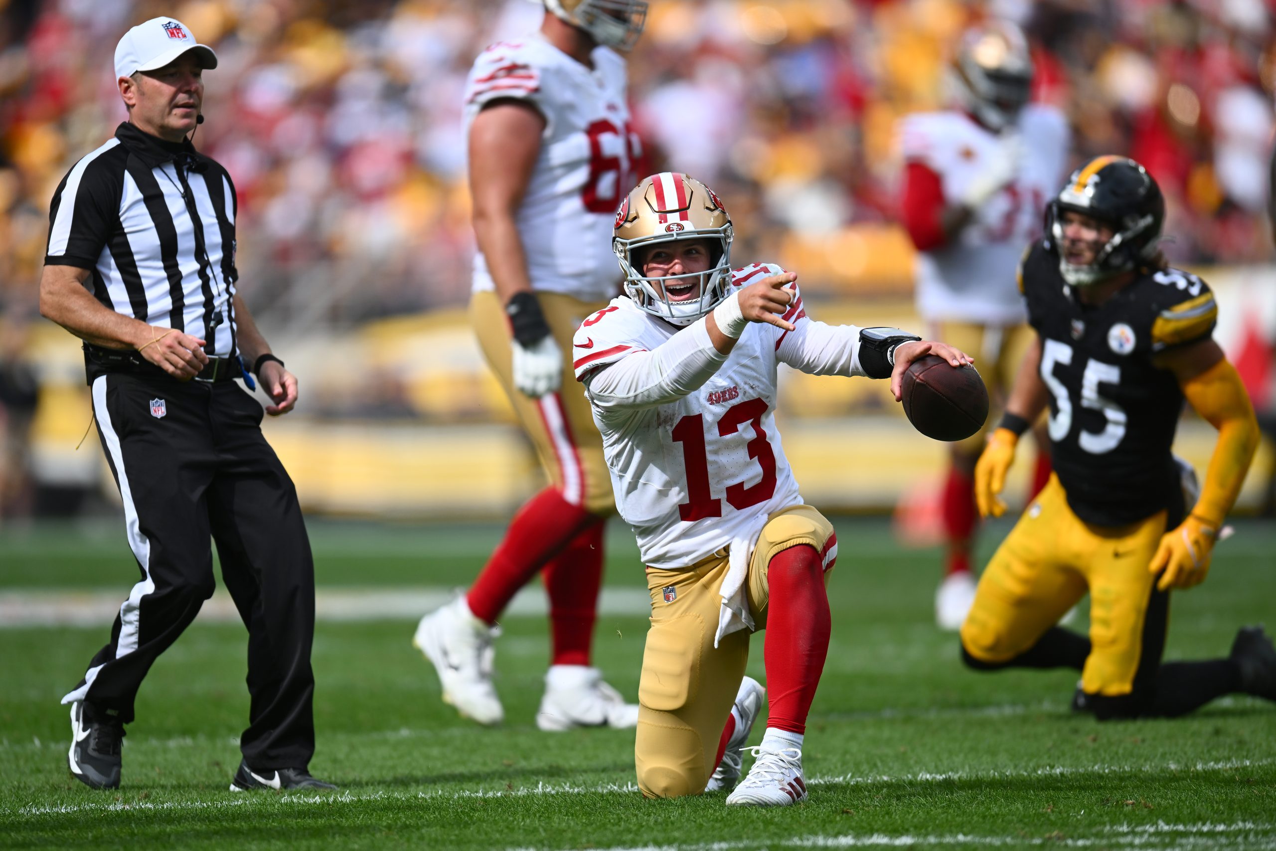 Brock Purdy #13 of the San Francisco 49ers reacts after running for a first down in the fourth quar...