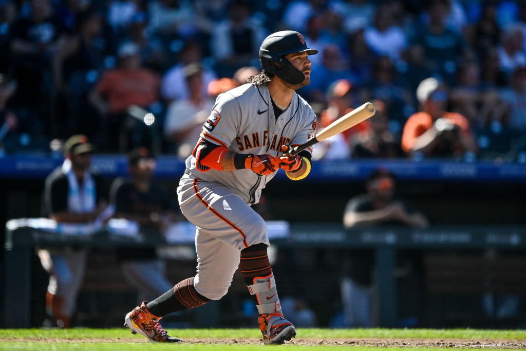 Brandon Crawford #35 of the San Francisco Giants follows the flight of the ball after hitting a six...