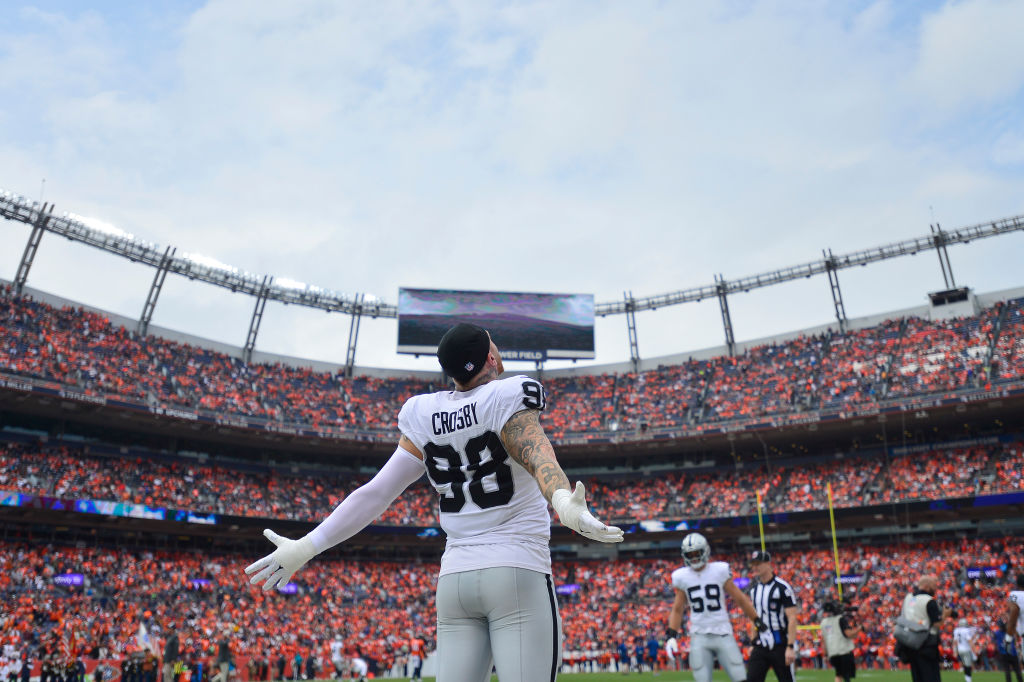 Maxx Crosby #98 of the Las Vegas Raiders reacts during pregame against the Denver Broncos at Empowe...