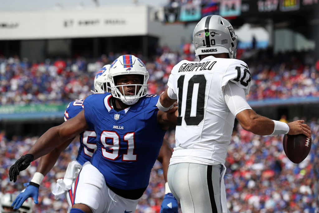 Ed Oliver #91 of the Buffalo Bills pressures Jimmy Garoppolo #10 of the Las Vegas Raiders during th...