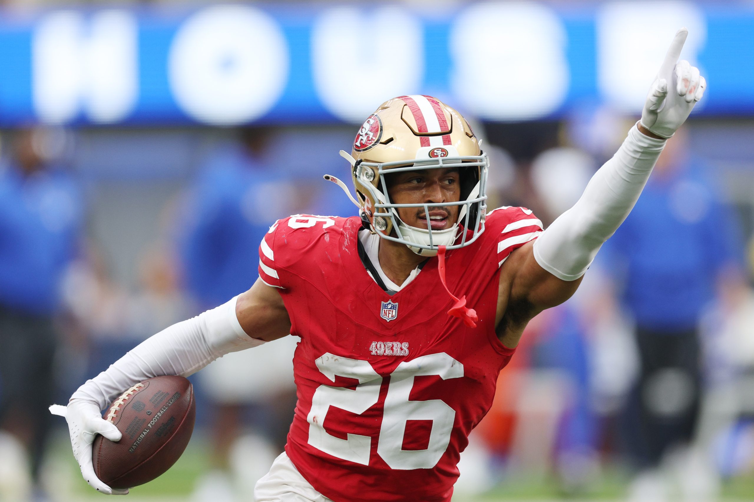 Isaiah Oliver #26 of the San Francisco 49ers celebrates an interception during the third quarter ag...