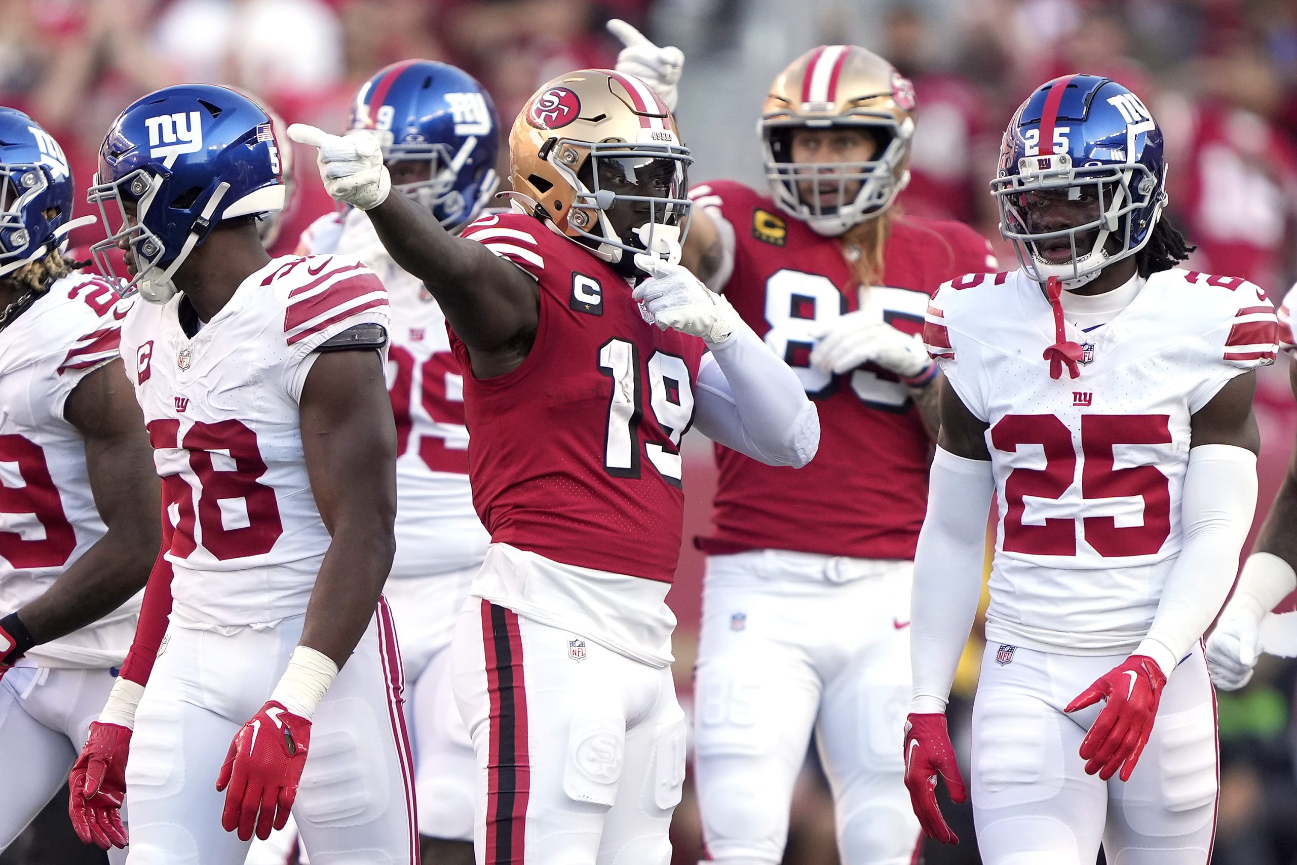 Deebo Samuel #19 of the San Francisco 49ers celebrates a first down against the New York Giants dur...