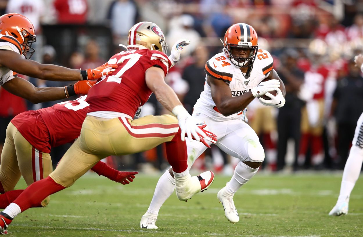 Nick Chubb #24 of the Cleveland Browns is tackled by Nick Bosa #97 of the San Francisco 49ers at Le...