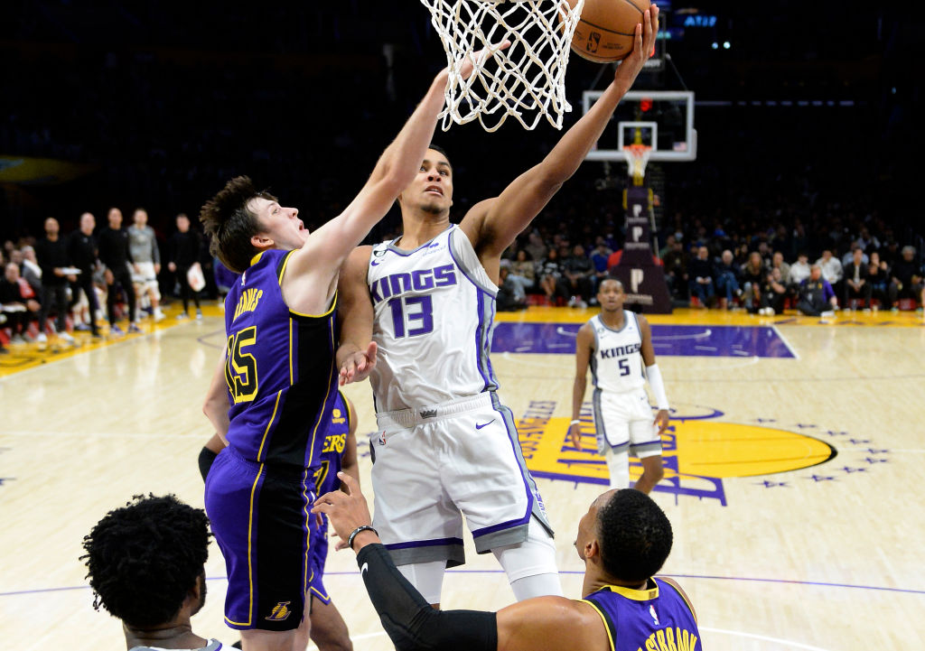 LOS ANGELES, CA - NOVEMBER 11: Keegan Murray #13 of the Sacramento Kings drives to the basket again...