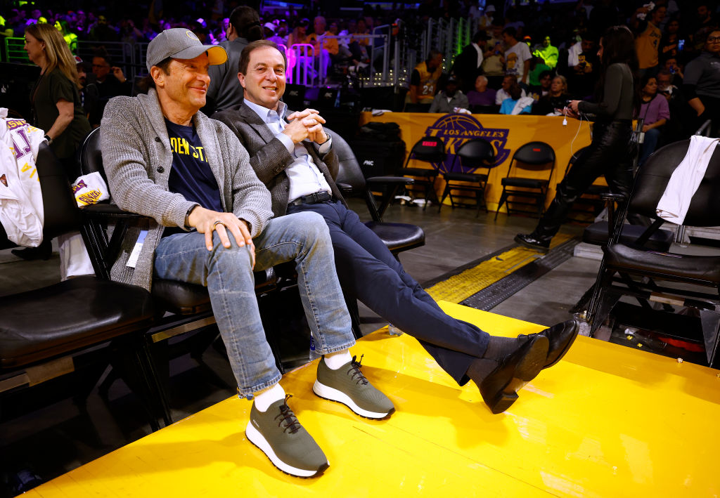 Golden State Warriors owners Joe Lacob and Peter Guber sit courtside for the game against the Los A...