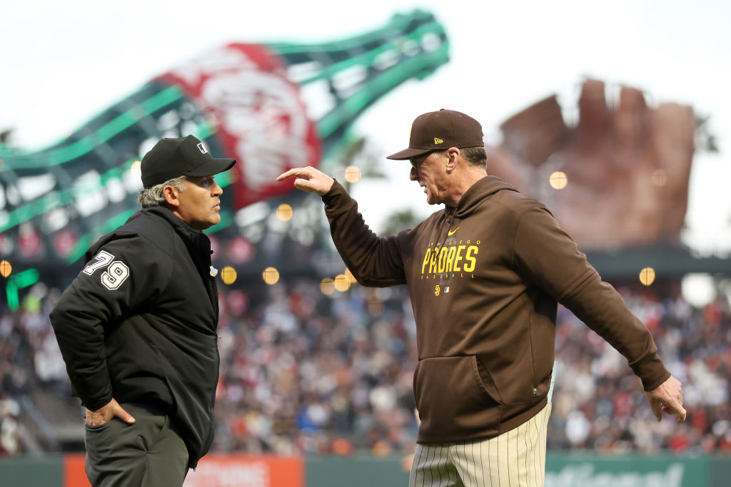 San Diego Padres manager Bob Melvin argues a reversal of a call due to instant replay with crew chi...