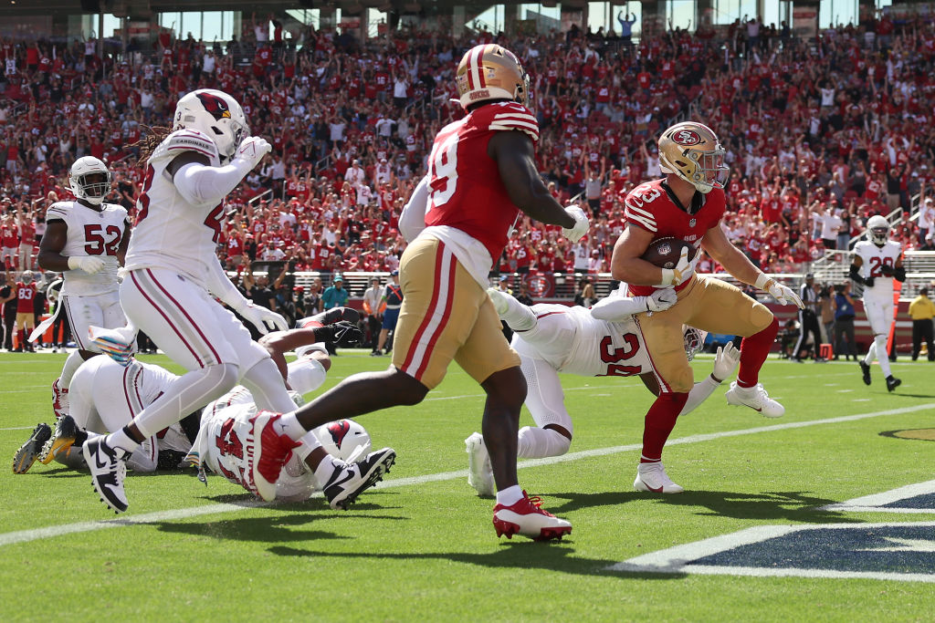 Christian McCaffrey #23 of the San Francisco 49ers runs the ball for a touchdown during the second ...