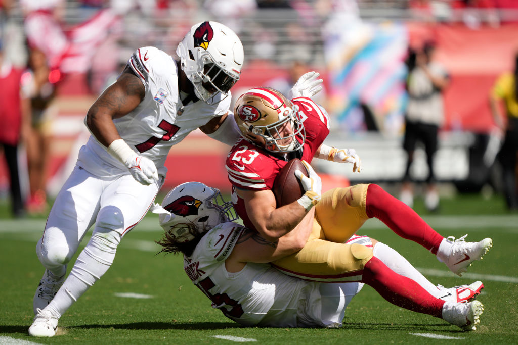Christian McCaffrey #23 of the San Francisco 49ers makes a touchdown reception during the second qu...
