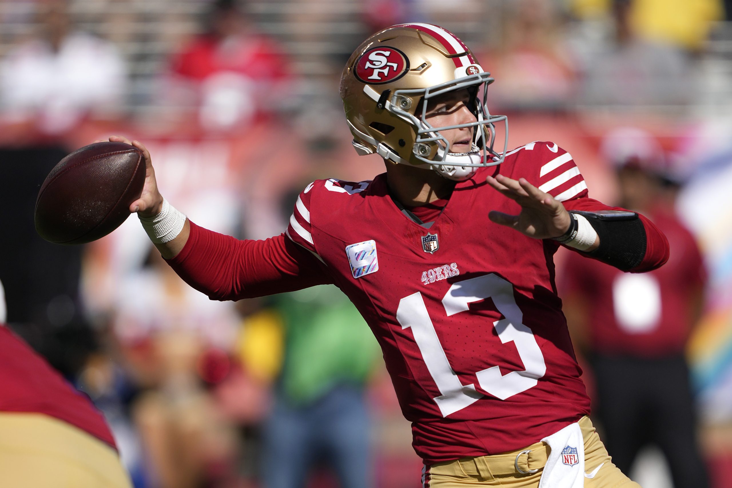 Brock Purdy #13 of the San Francisco 49ers passes the ball against the Arizona Cardinals during the...
