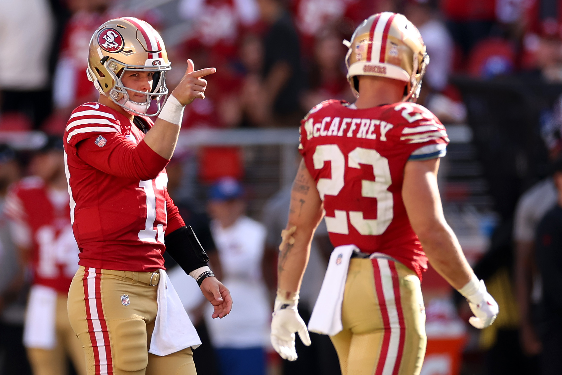 Brock Purdy #13 of the San Francisco 49ers celebrates a first down pass during the fourth quarter a...