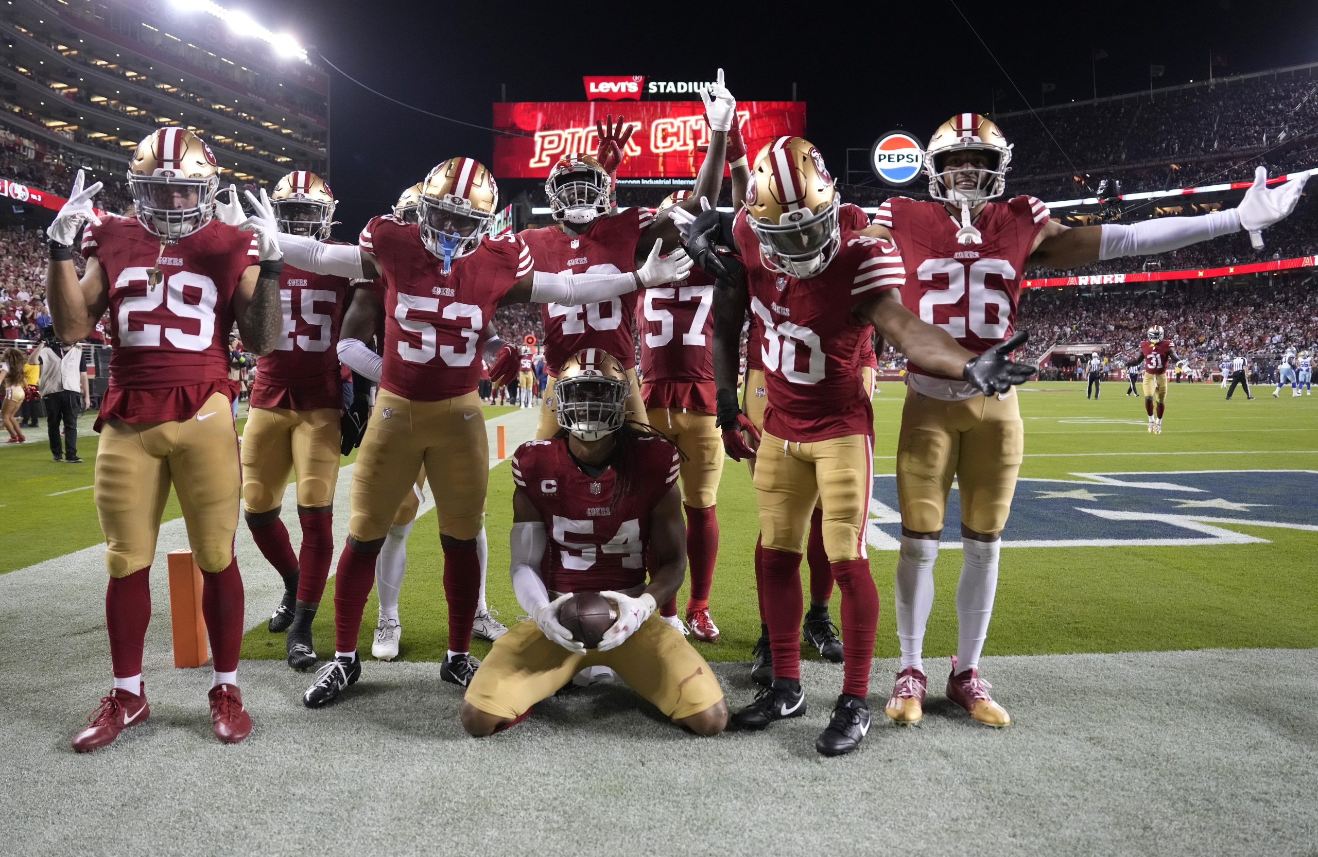 Fred Warner #54 of the San Francisco 49ers celebrates with teammates after an interception during t...