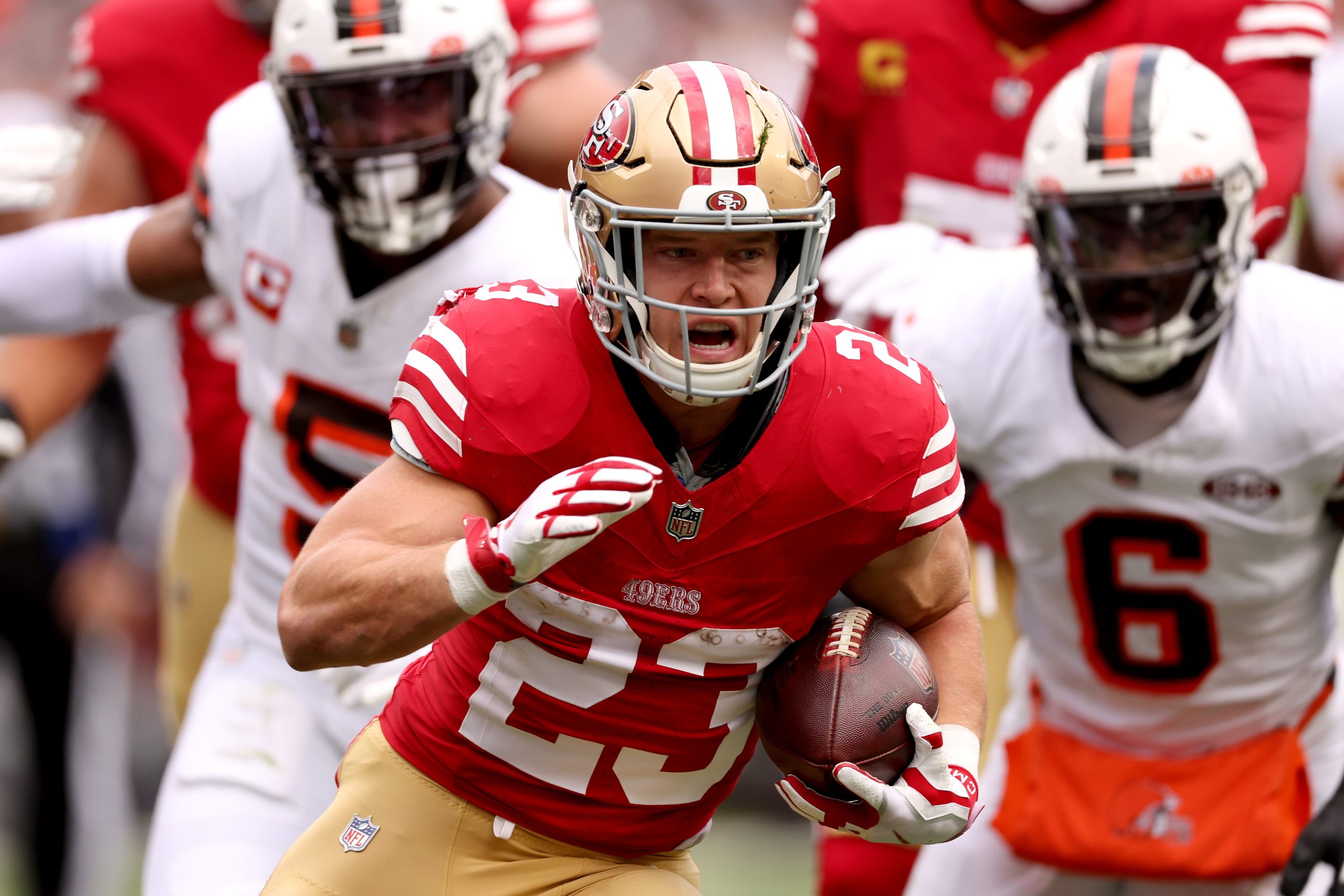 Christian McCaffrey #23 of the San Francisco 49ers runs for a touchdown after a catch during the fi...