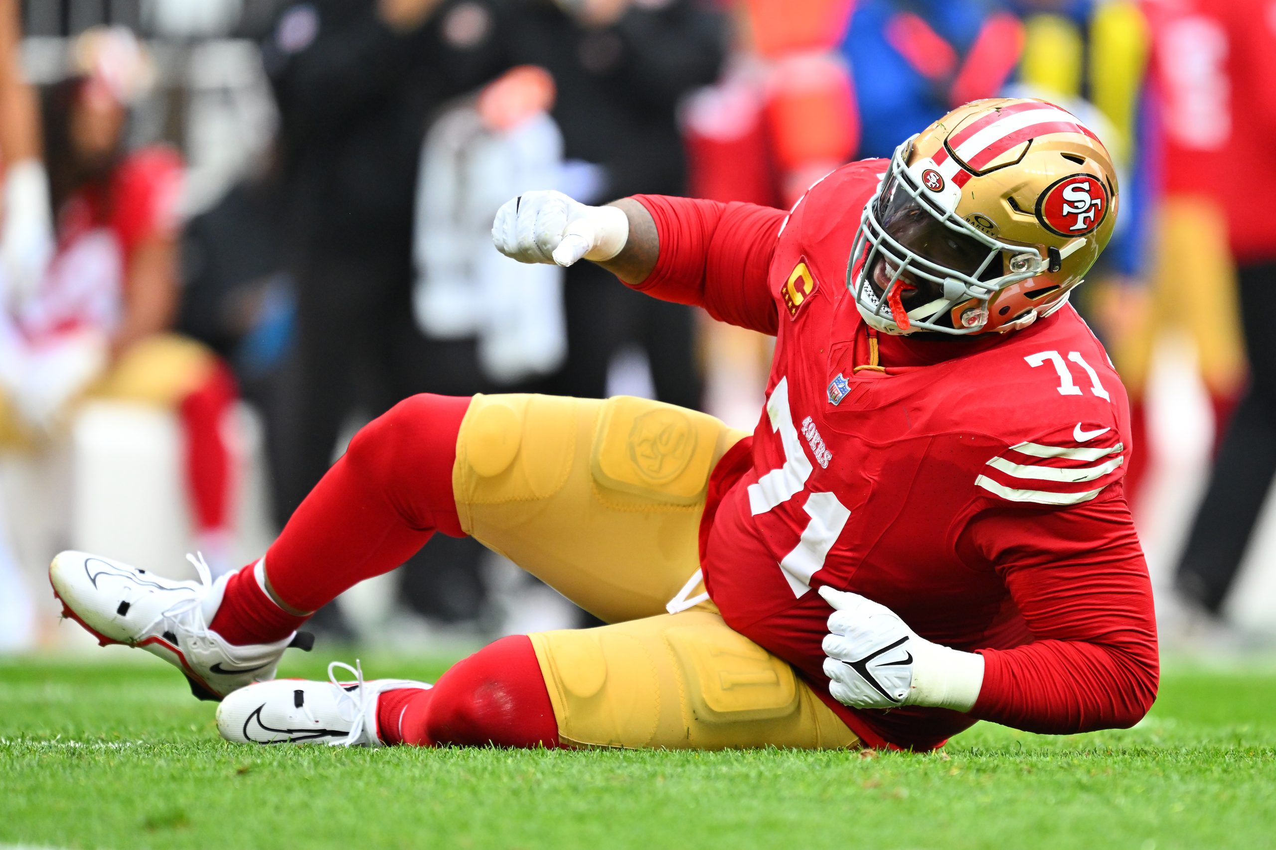 Trent Williams #71 of the San Francisco 49ers reacts after an injury during the first quarter again...