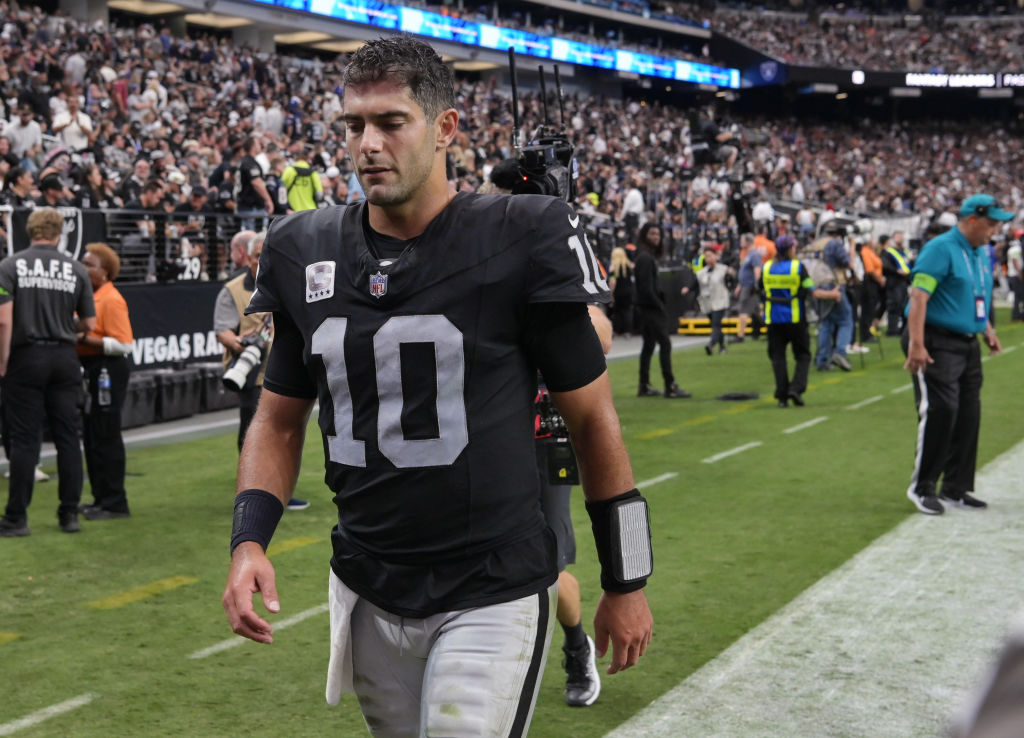 Jimmy Garoppolo #10 of the Las Vegas Raiders walks off the field in the first half against the New ...