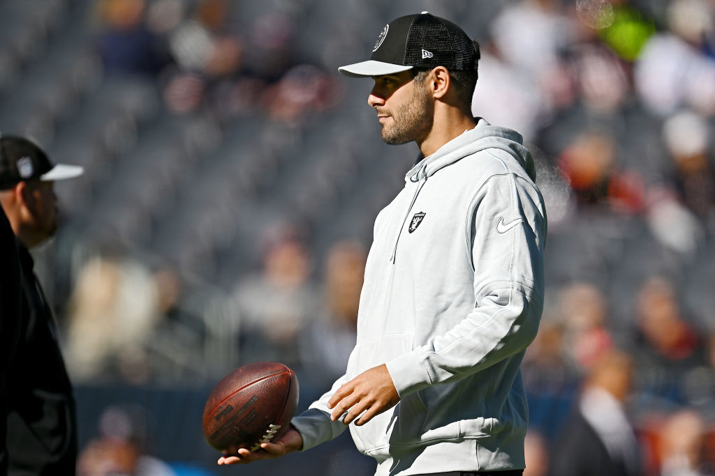Jimmy Garoppolo #10 of the Las Vegas Raiders walks the field before the game against the Chicago Be...