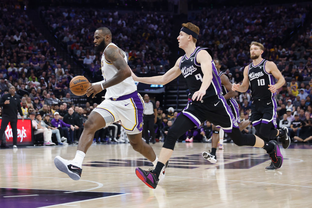 LeBron James #23 of the Los Angeles Lakers drives to the basket against Kevin Huerter #9 of the Sac...