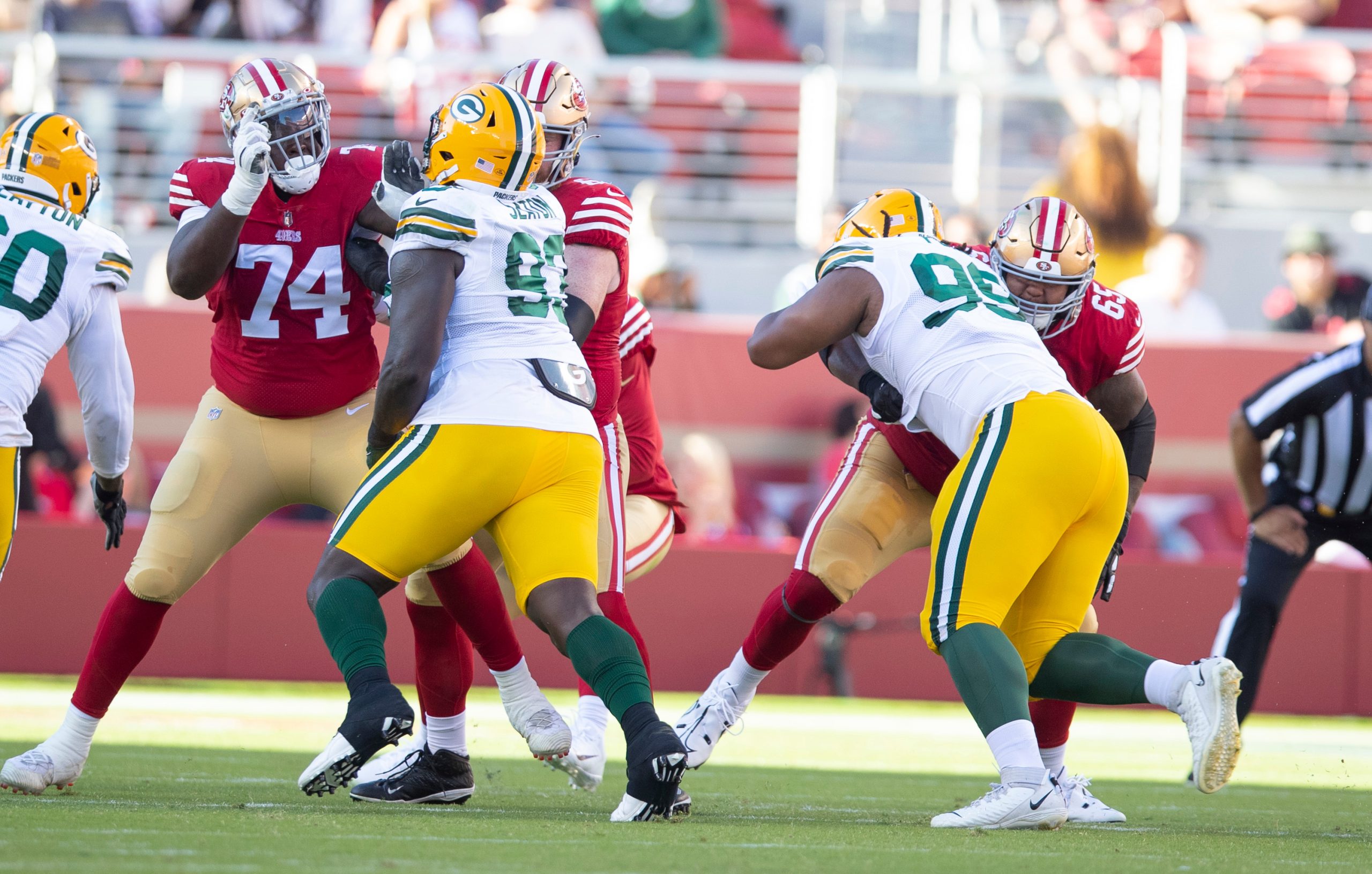 Spencer Burford #74 and Aaron Banks #65 of the San Francisco 49ers block during the game against th...